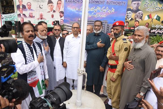 *Karachi Development Authority* on the occasion of 77th Independence Day of Pakistan Minister Local Government Sindh Saeed Ghani and Director General KDA Syed Shujaat Hussain are hoisting the national flag at Civic Center Building.